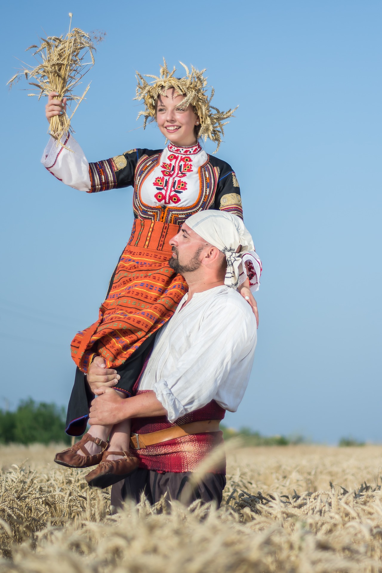 A man and woman with wheat harvest